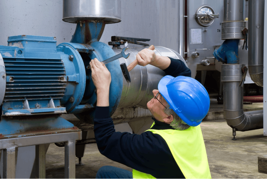 Technician inspecting an agricultural pump before installation 
